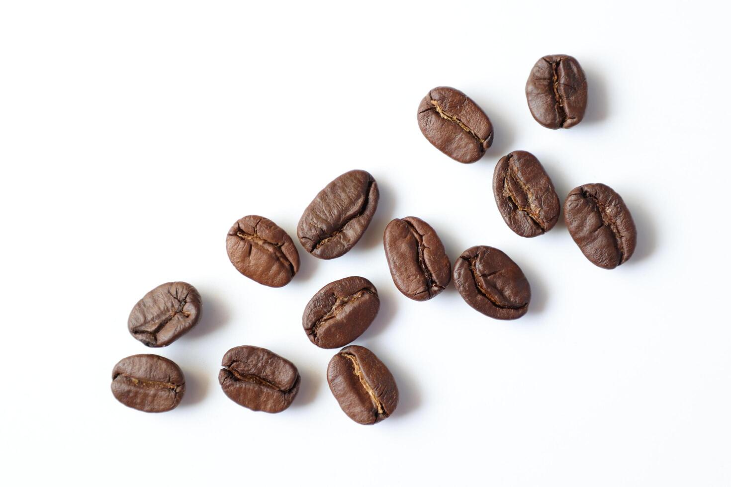 Bean isolated on white, brown roasted coffee beans on white photo