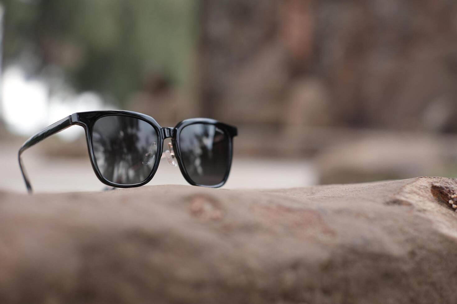 Sunglasses on the beach in summer photo
