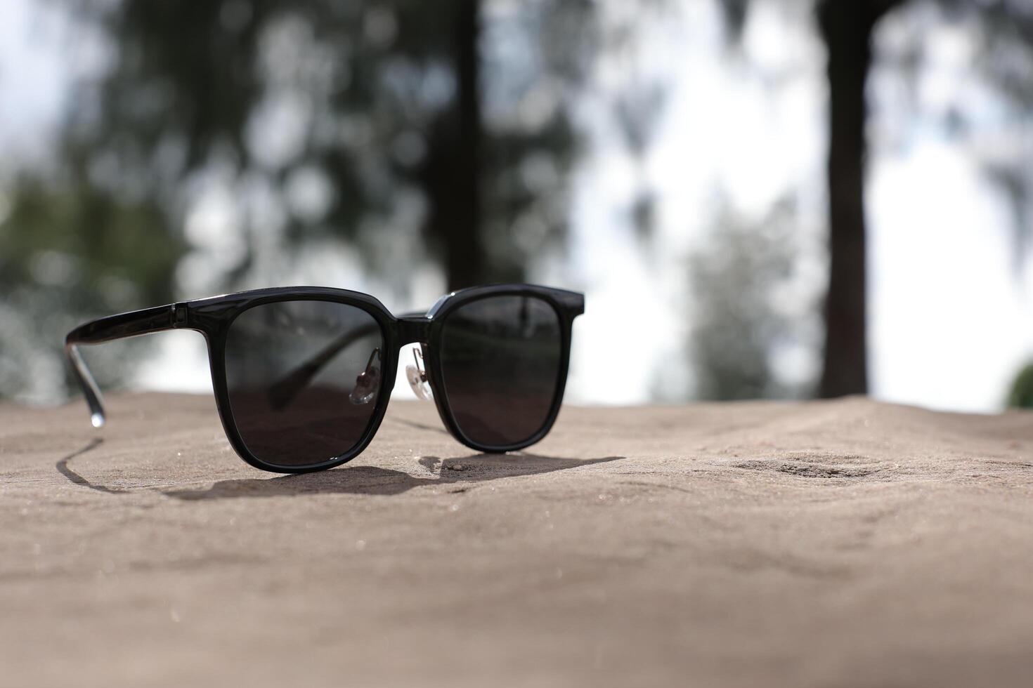 Sunglasses on the beach in summer photo