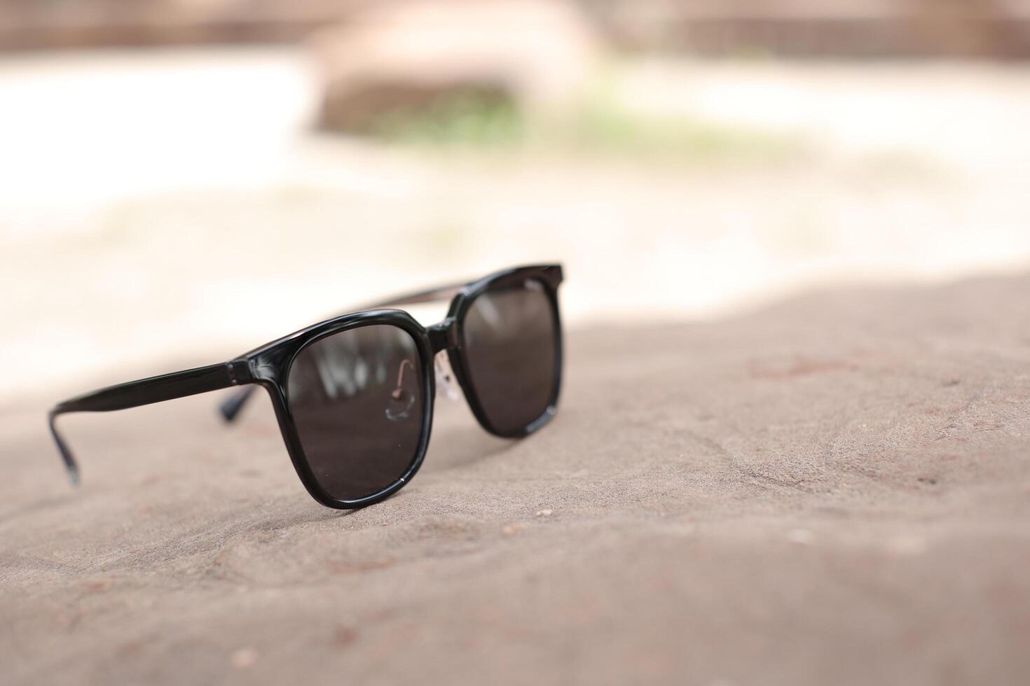 Sunglasses on the beach in summer photo