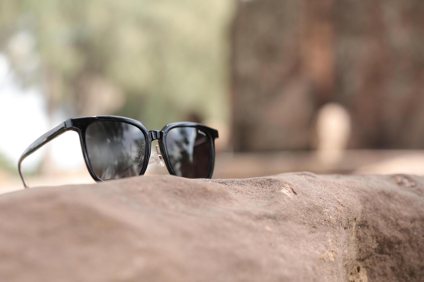 Sunglasses on the beach in summer photo