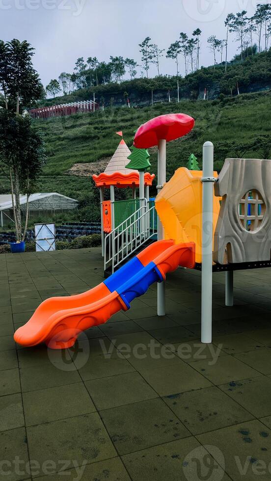 children's play area playground slide at lembah indah, Malang, Indonesia photo