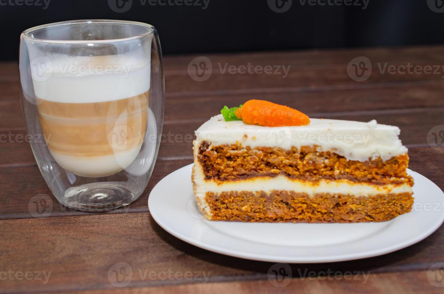 Carrot sponge cake with cream and walnuts and Cappuccino coffee photo