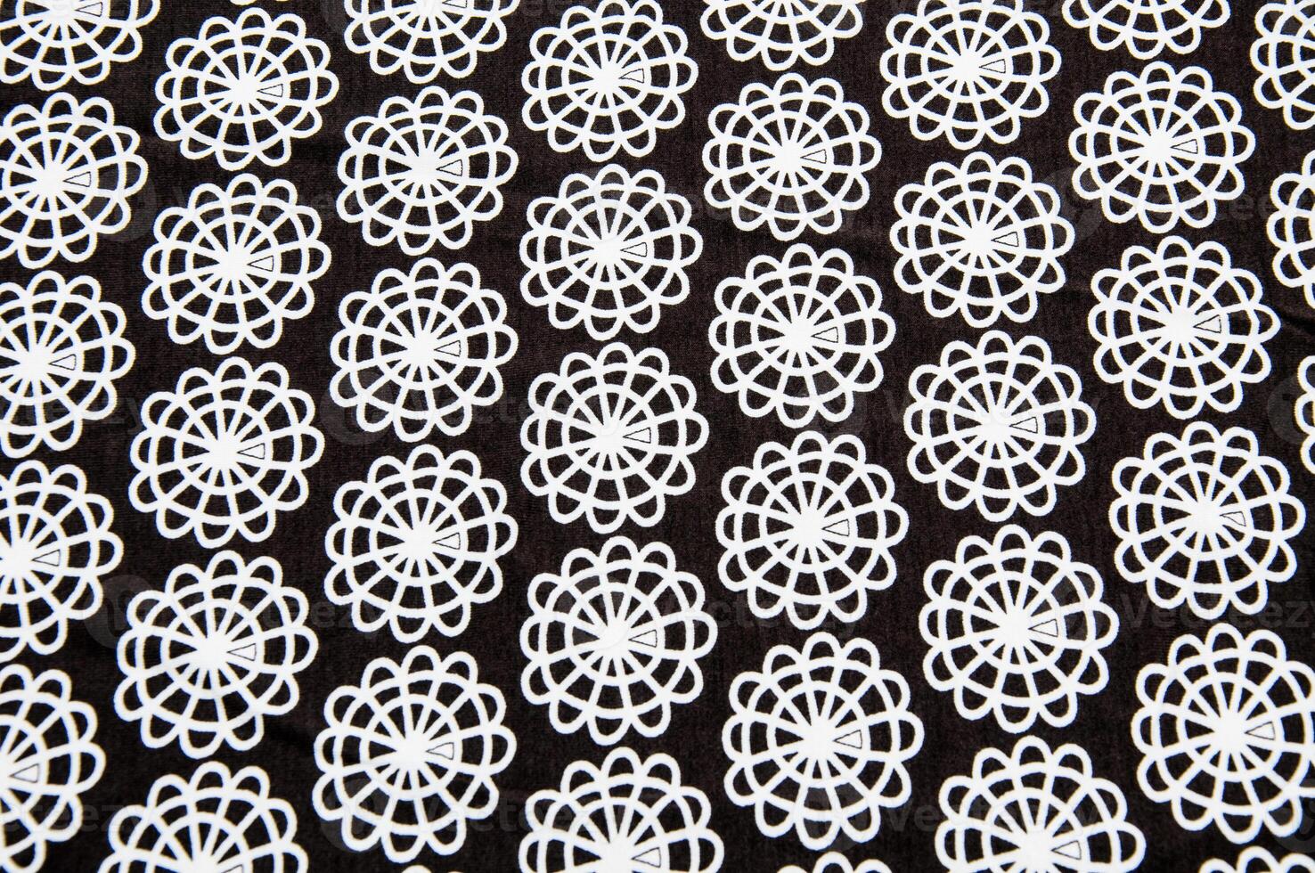 Black tissue with white round abstract figures photo