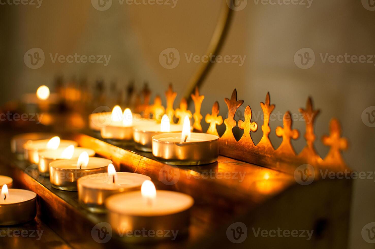 Candles on the table in orthodox church photo