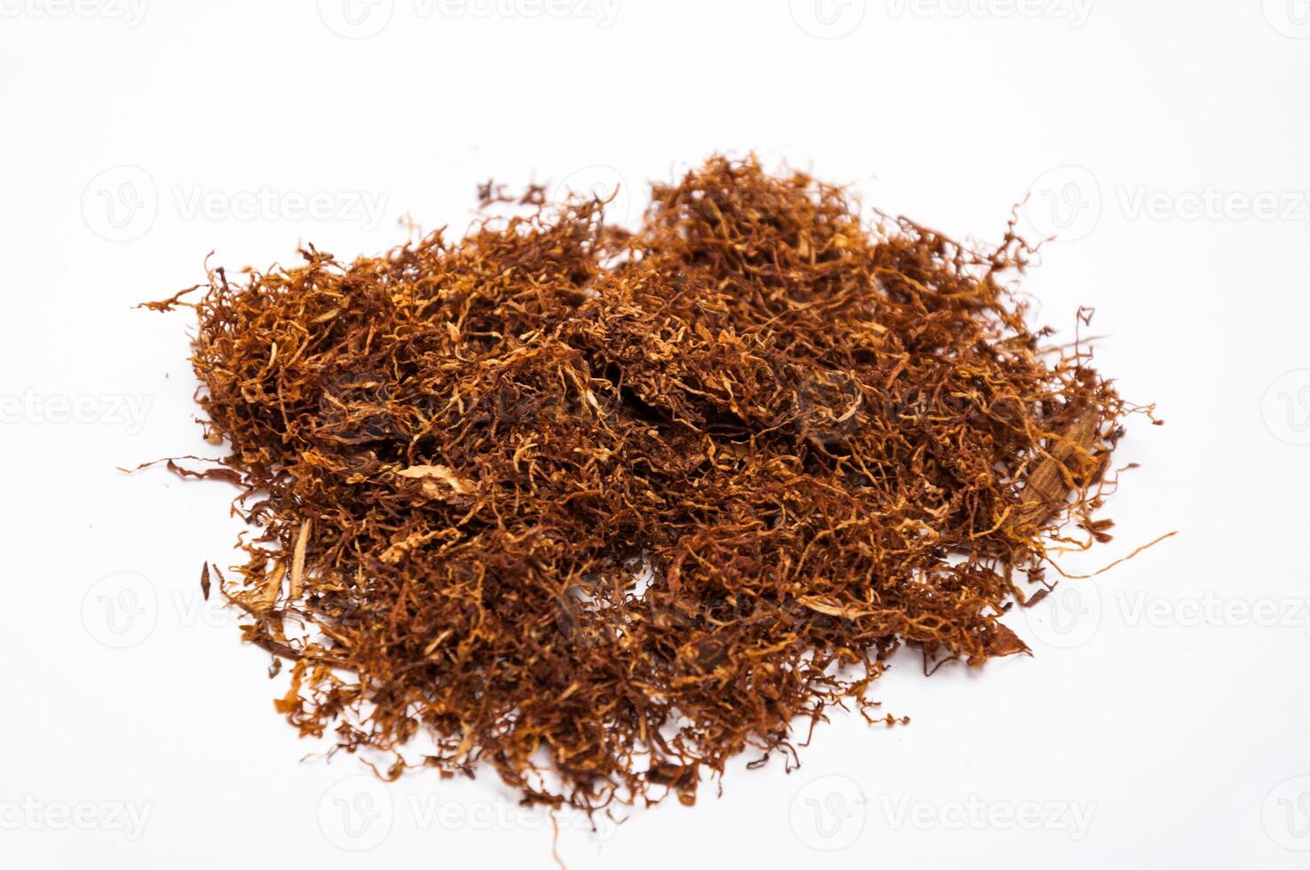 Hand rolling tobacco close up on the white photo