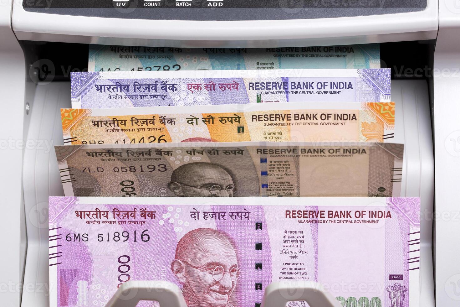 Indian rupee in a counting machine photo