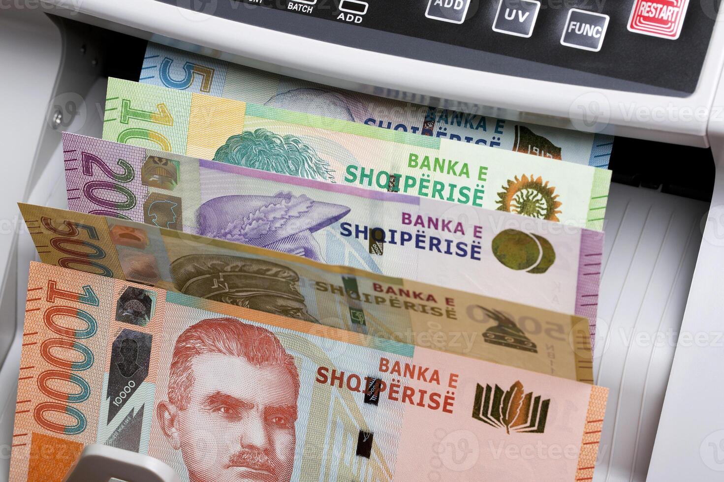 Albanian lek in a counting machine photo