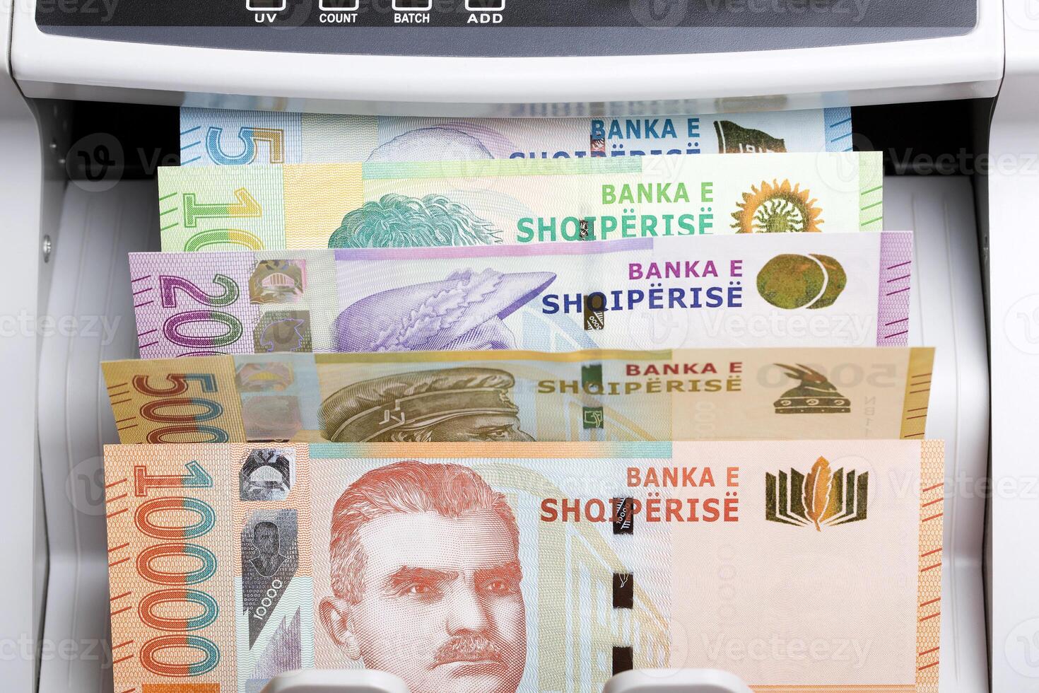 Albanian lek in a counting machine photo