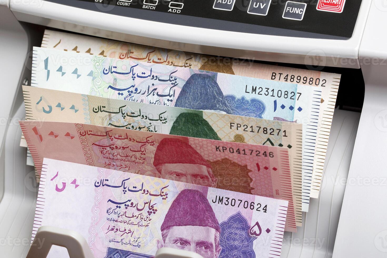 Pakistani rupee in a counting machine photo