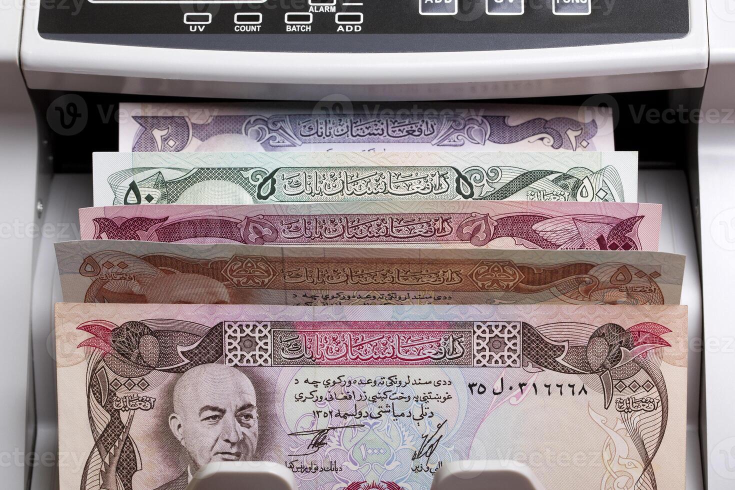 Old Afghan Afghani in a counting machine photo