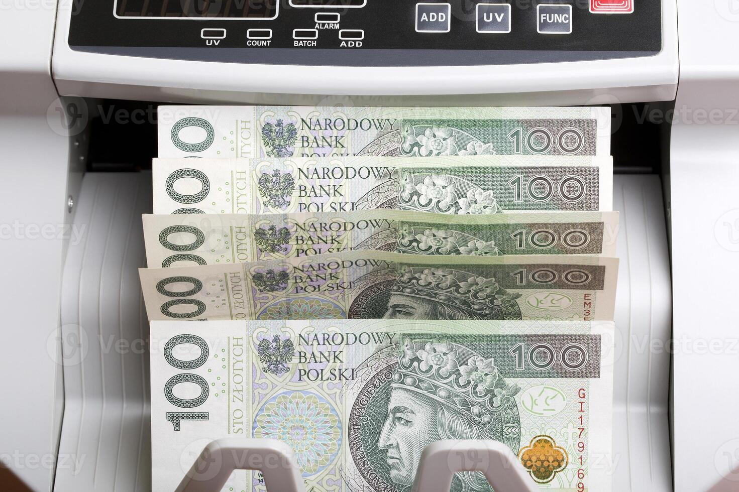 Polish money in a counting machine photo