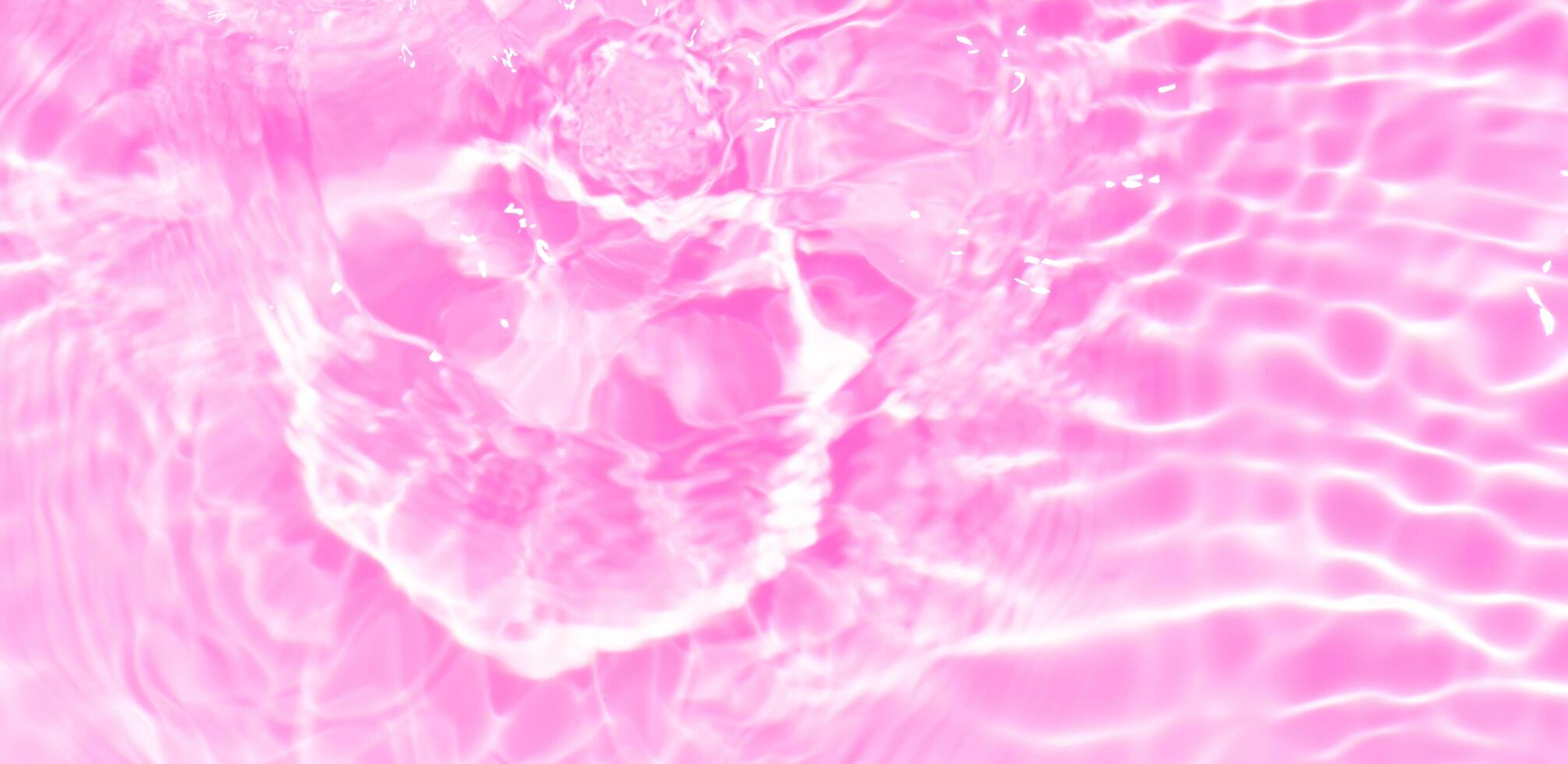 Bluewater waves on the surface ripples blurred. Defocus blurred transparent blue colored clear calm water surface texture with splash and bubbles. Water waves with shining pattern texture background. photo