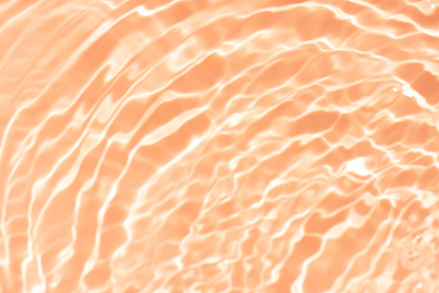 Bluewater waves on the surface ripples blurred. Defocus blurred transparent blue colored clear calm water surface texture with splash and bubbles. Water waves with shining pattern texture background. photo