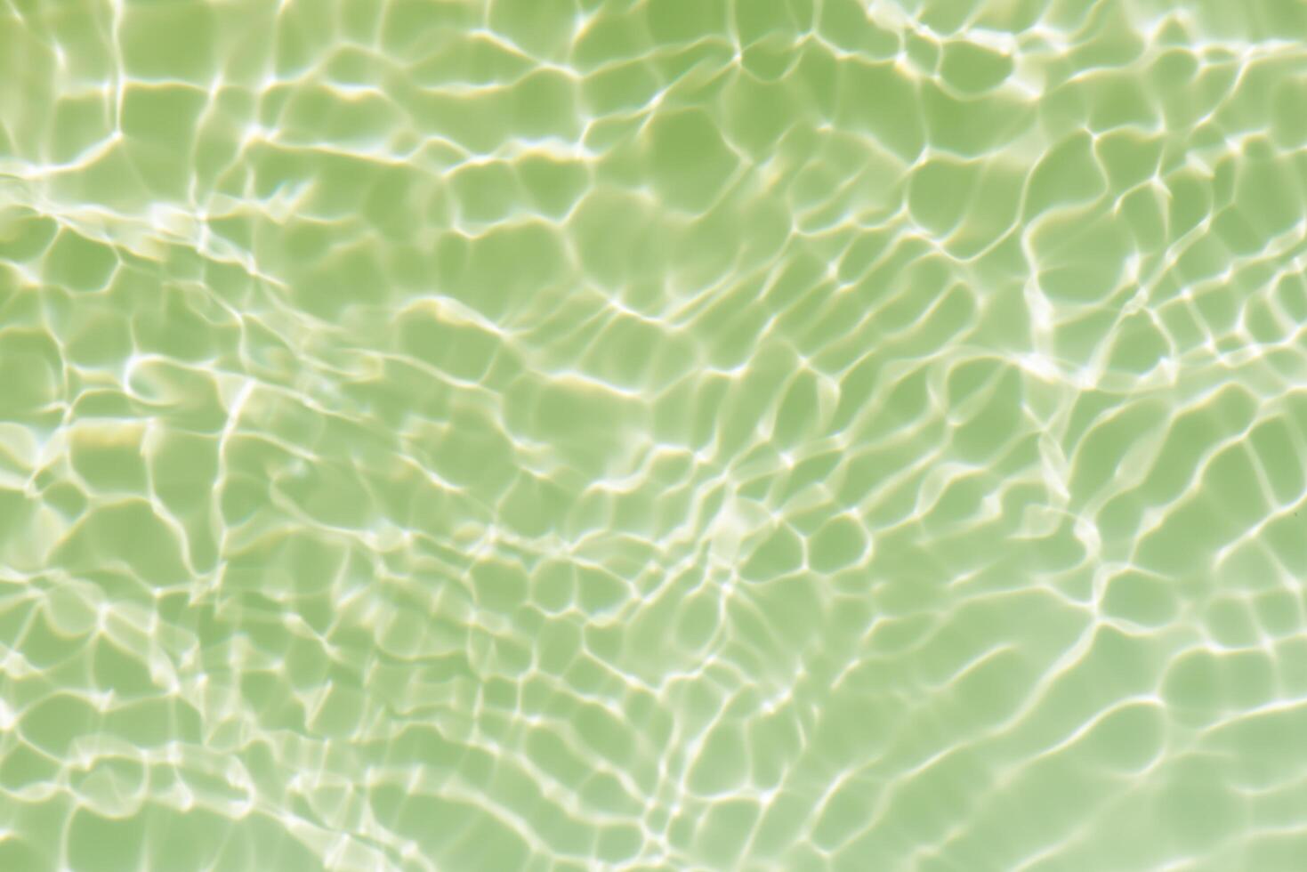 Blue water with ripples on the surface. Defocus blurred transparent blue colored clear calm water surface texture with splashes and bubbles. Water waves with shining pattern texture background. photo