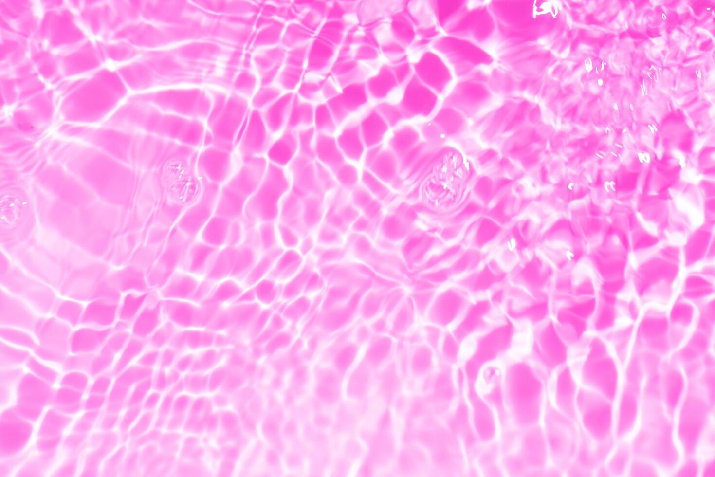 Blue water with ripples on the surface. Defocus blurred transparent blue colored clear calm water surface texture with splashes and bubbles. Water waves with shining pattern texture background. photo