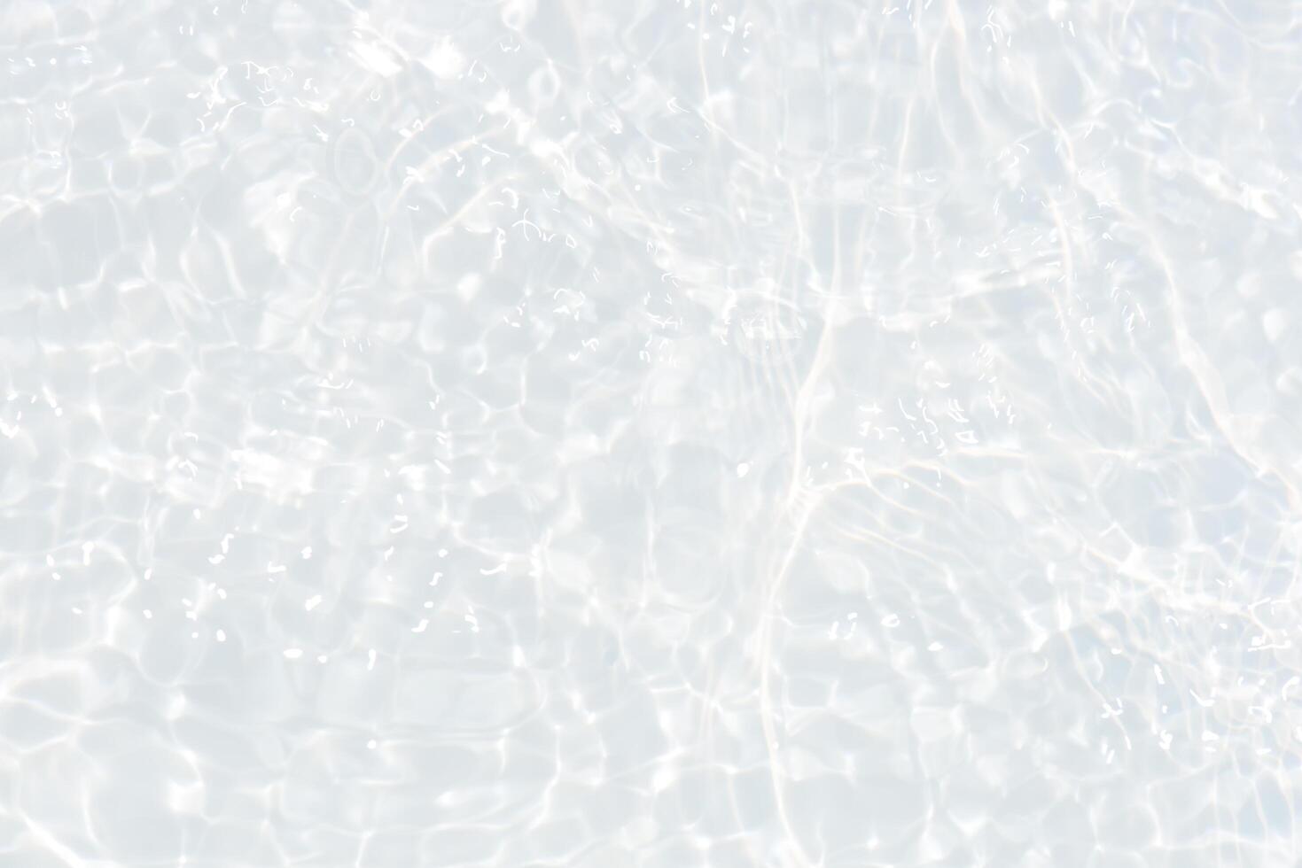 Bluewater waves on the surface ripples blurred. Defocus blurred transparent blue colored clear calm water surface texture with splash and bubbles. Water waves with shining pattern texture background. photo