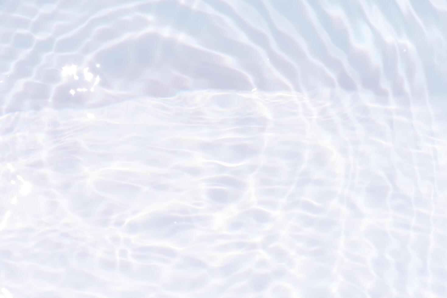 Bluewater waves on the surface ripples blurred. Defocus blurred transparent blue colored clear calm water surface texture with splash and bubbles. Water waves with shining pattern texture background. photo