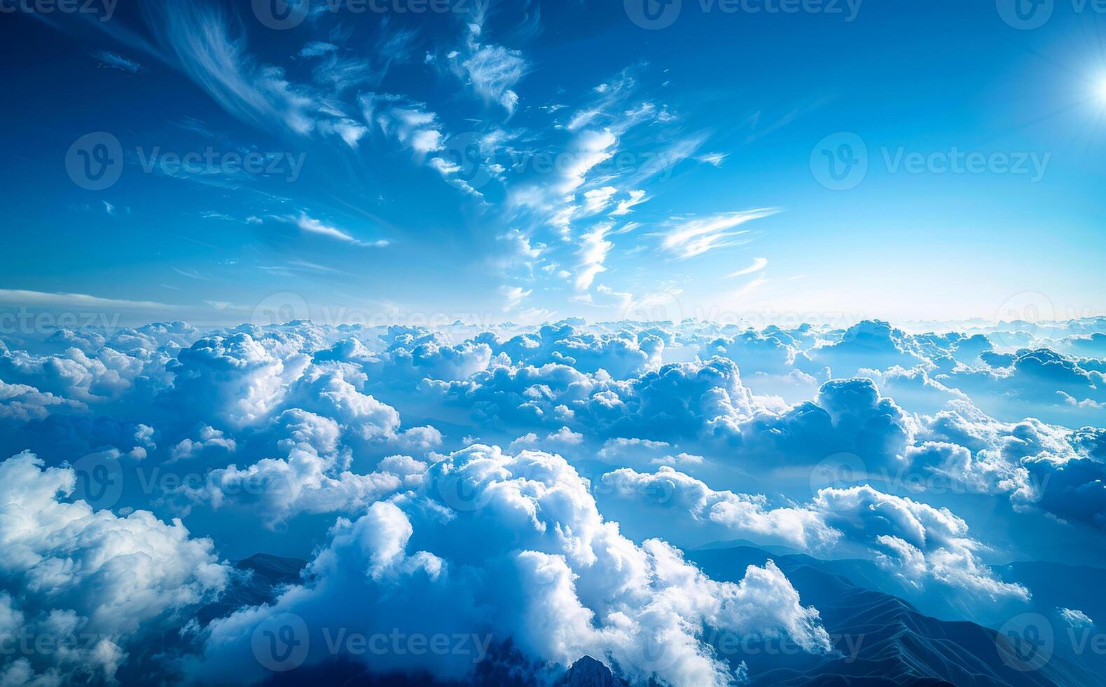 The sky is blue with a few clouds scattered throughout photo