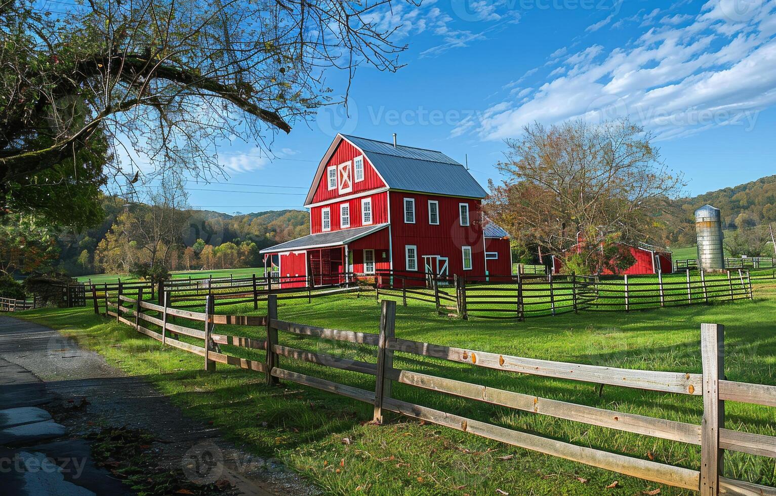 A red farmhouse with a large barn and a fenced-in yard photo