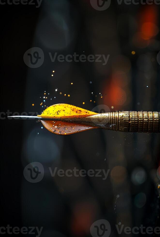 Golden dart is hitting the bullseye with black background photo
