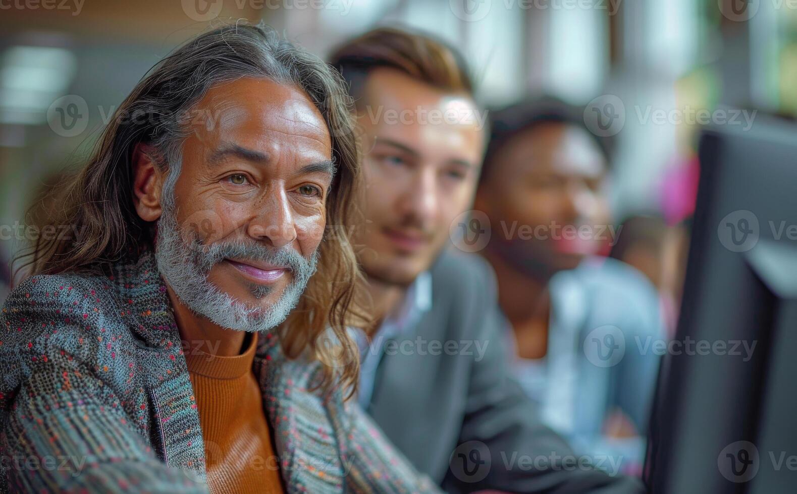Mature businessman using computer in modern office photo