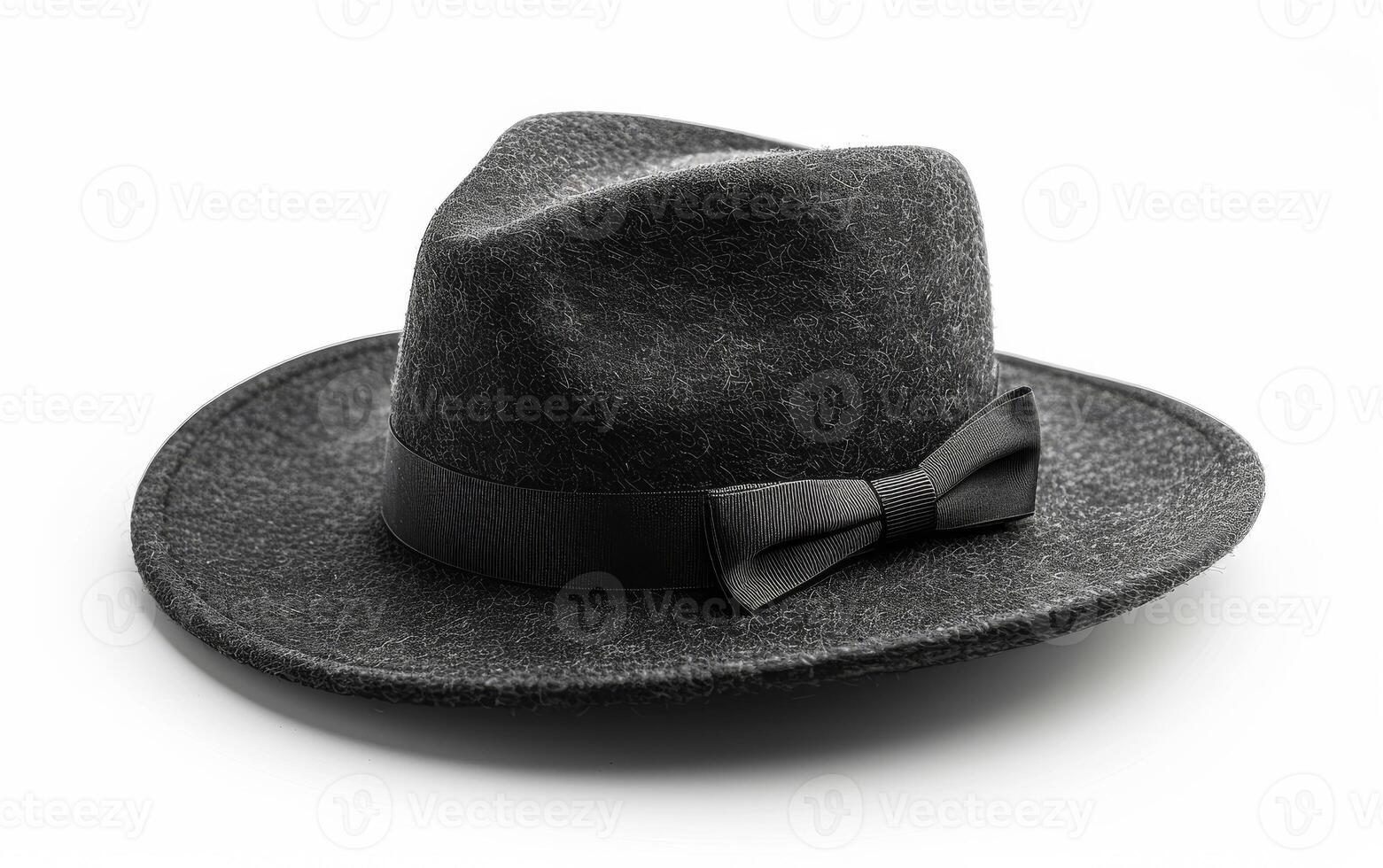 Black hat and bow tie on white background photo