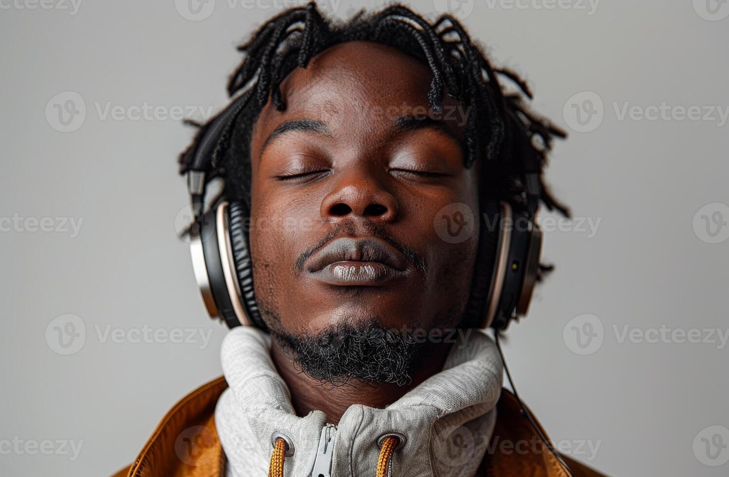 Portrait of young man listening music with headphones photo