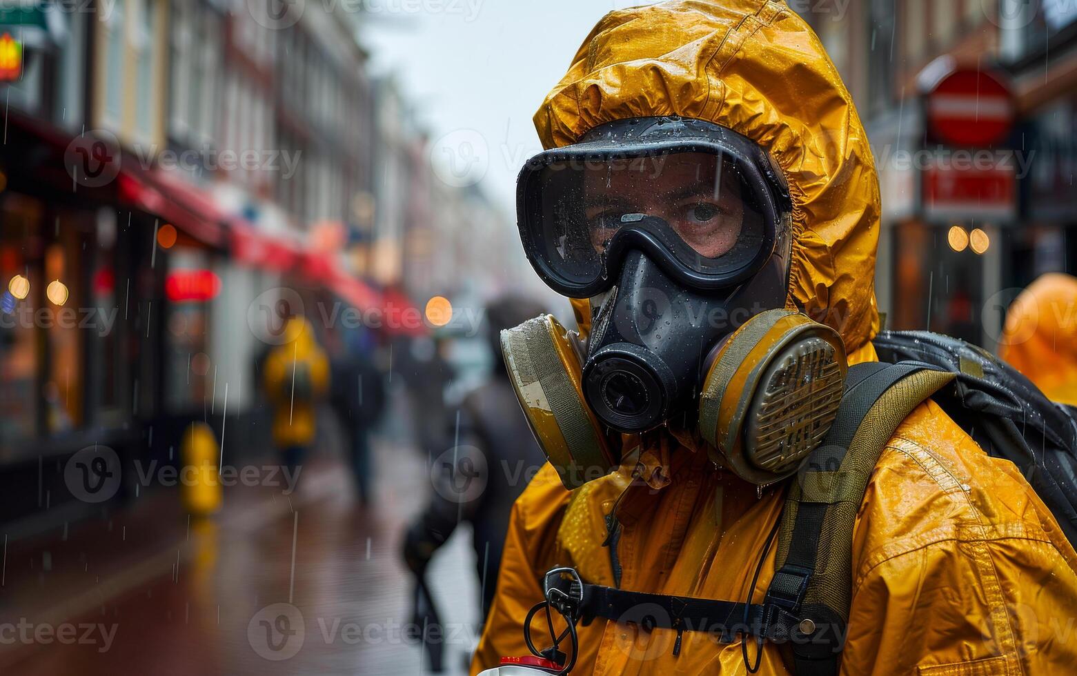 Man in yellow protective suit and gas mask photo