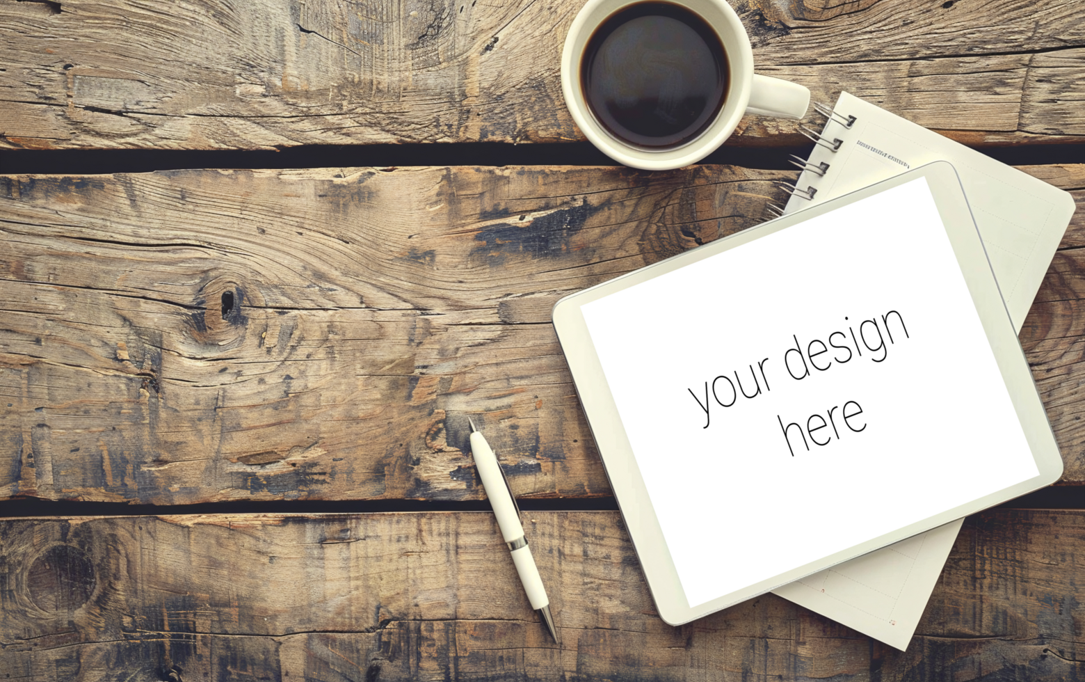 Tablet mockup. The device lies on wooden table next to a cup of coffee psd