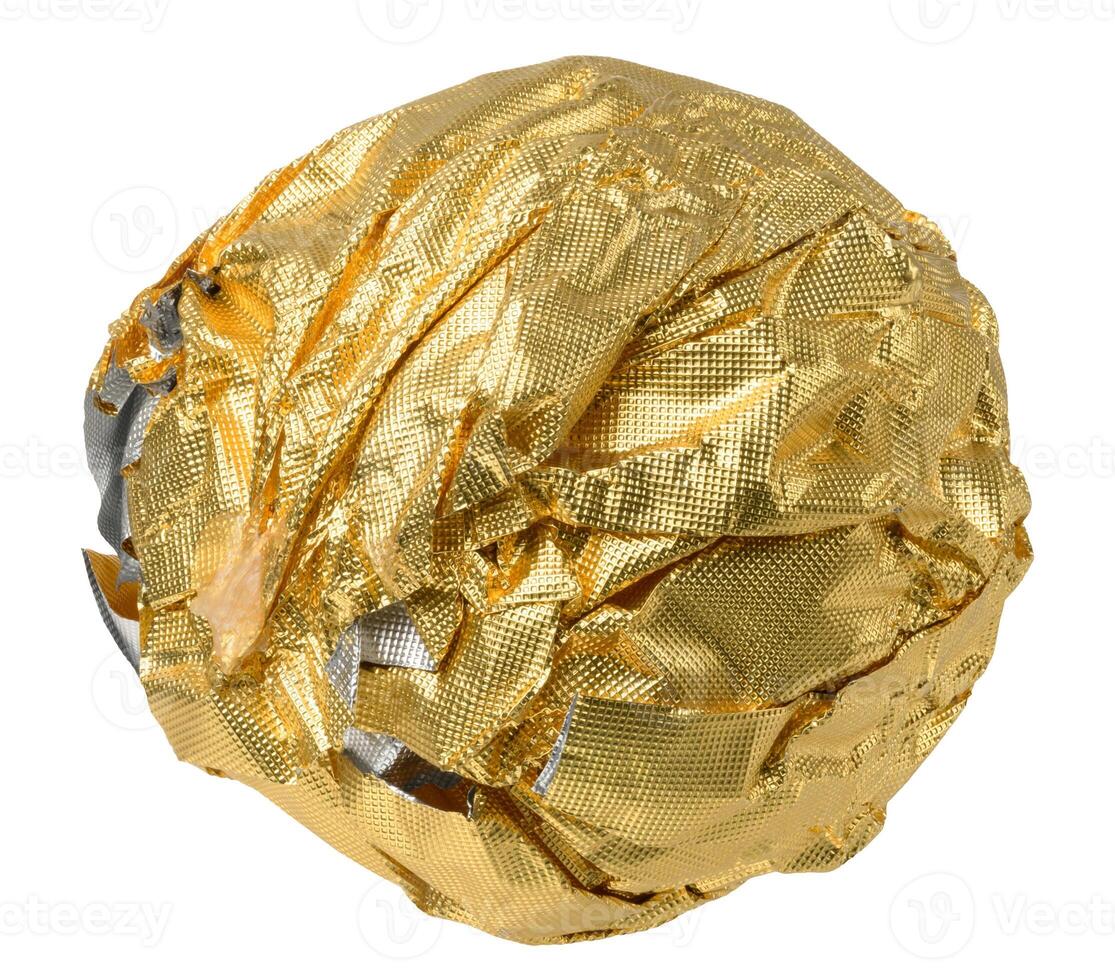 Ball of crumpled golden foil on isolated background photo