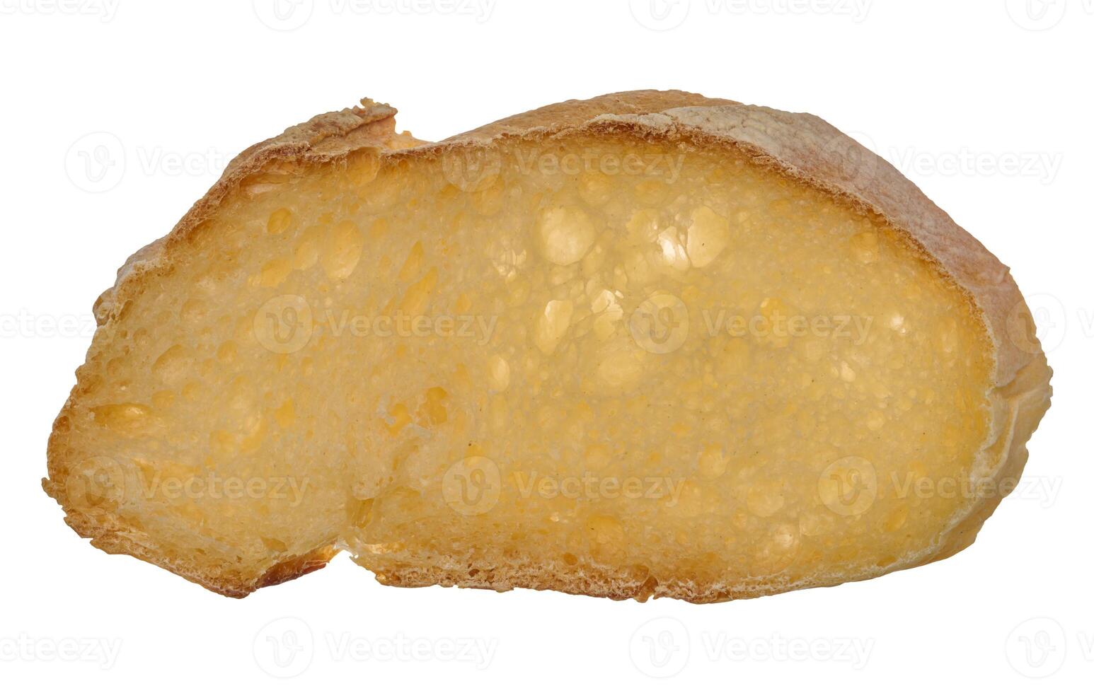Cut piece of white wheat flour bread on a white isolated background photo