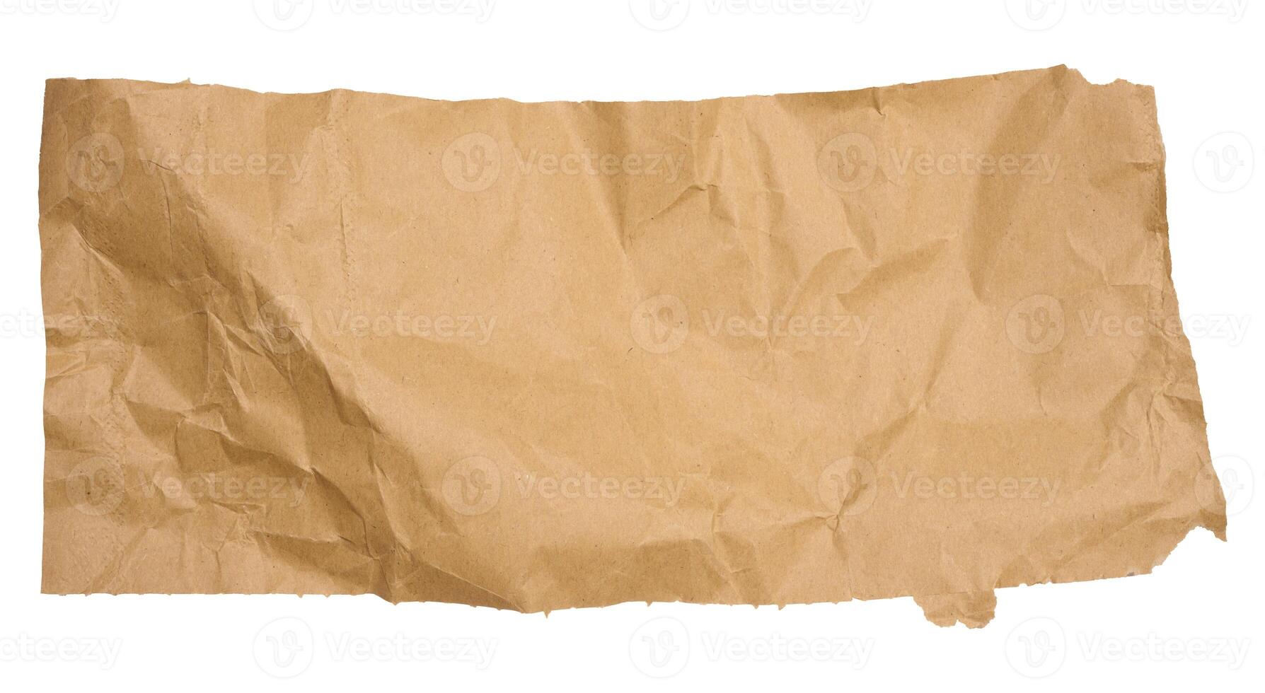 Torn piece of brown cardboard on a white isolated background photo