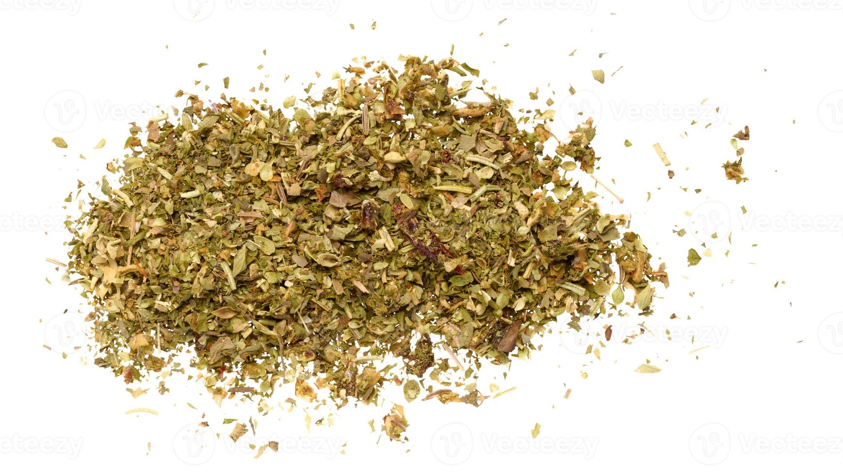 Dry ground basil leaves and crushed sun-dried tomatoes on isolated background photo