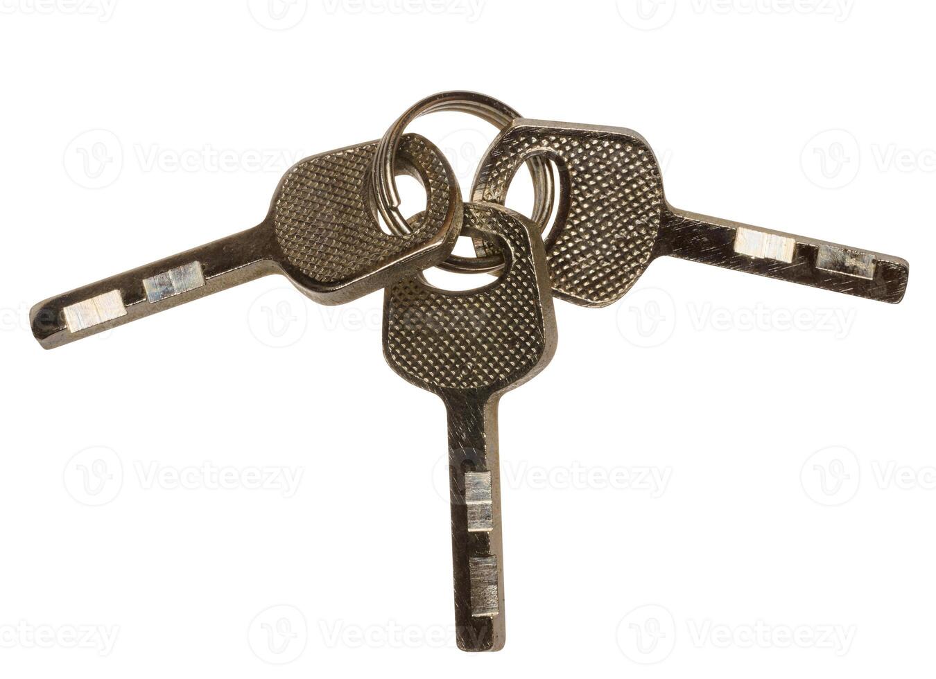 Bunch of three metal keys on isolated background photo
