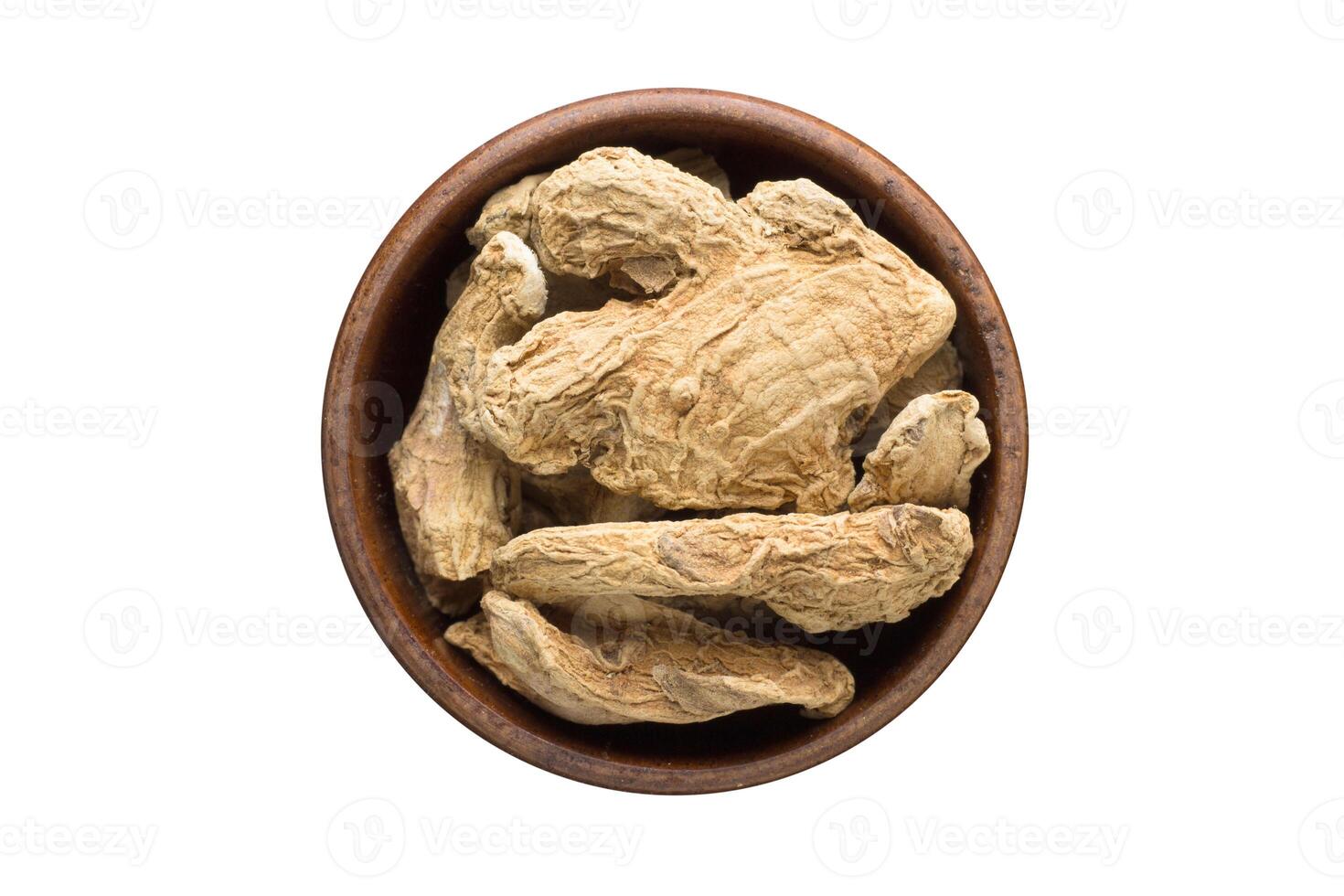 ginger root spice in wooden bowl, isolated on white background. Seasoning top view photo
