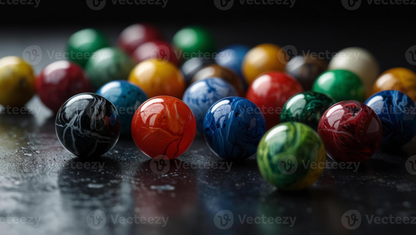 Marbles clustered on black surface, various colored marble tops. photo