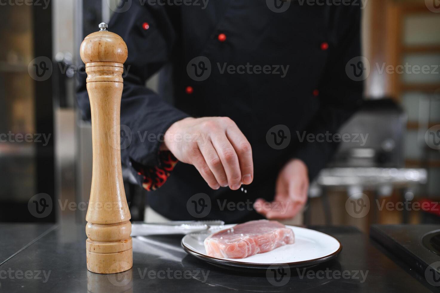 Chef cooks pork steak. Recipe book, cooking, restaurant business photo