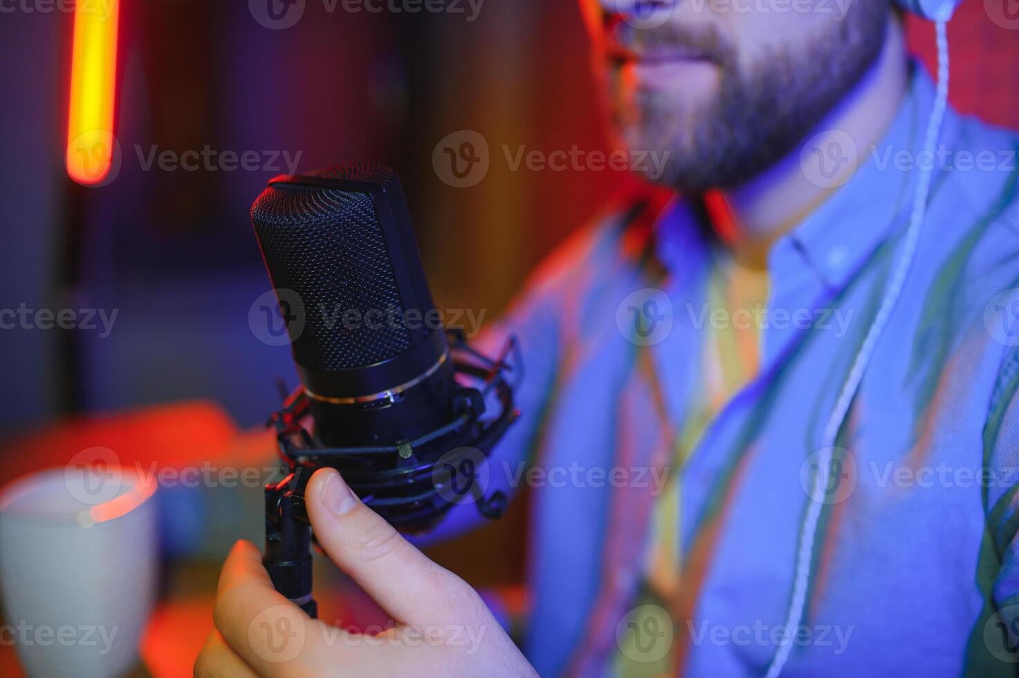 Man singing in a recording studio photo