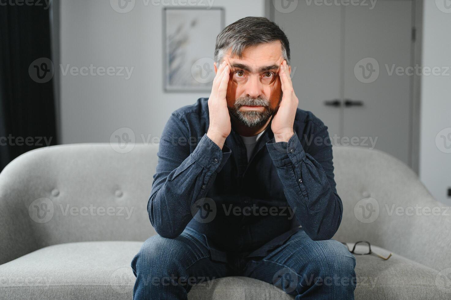Headache. Senior Man Suffering From Migraine Pain Massaging Temples Sitting At Home. Healthcare, Health Problems In Older Age Concept photo