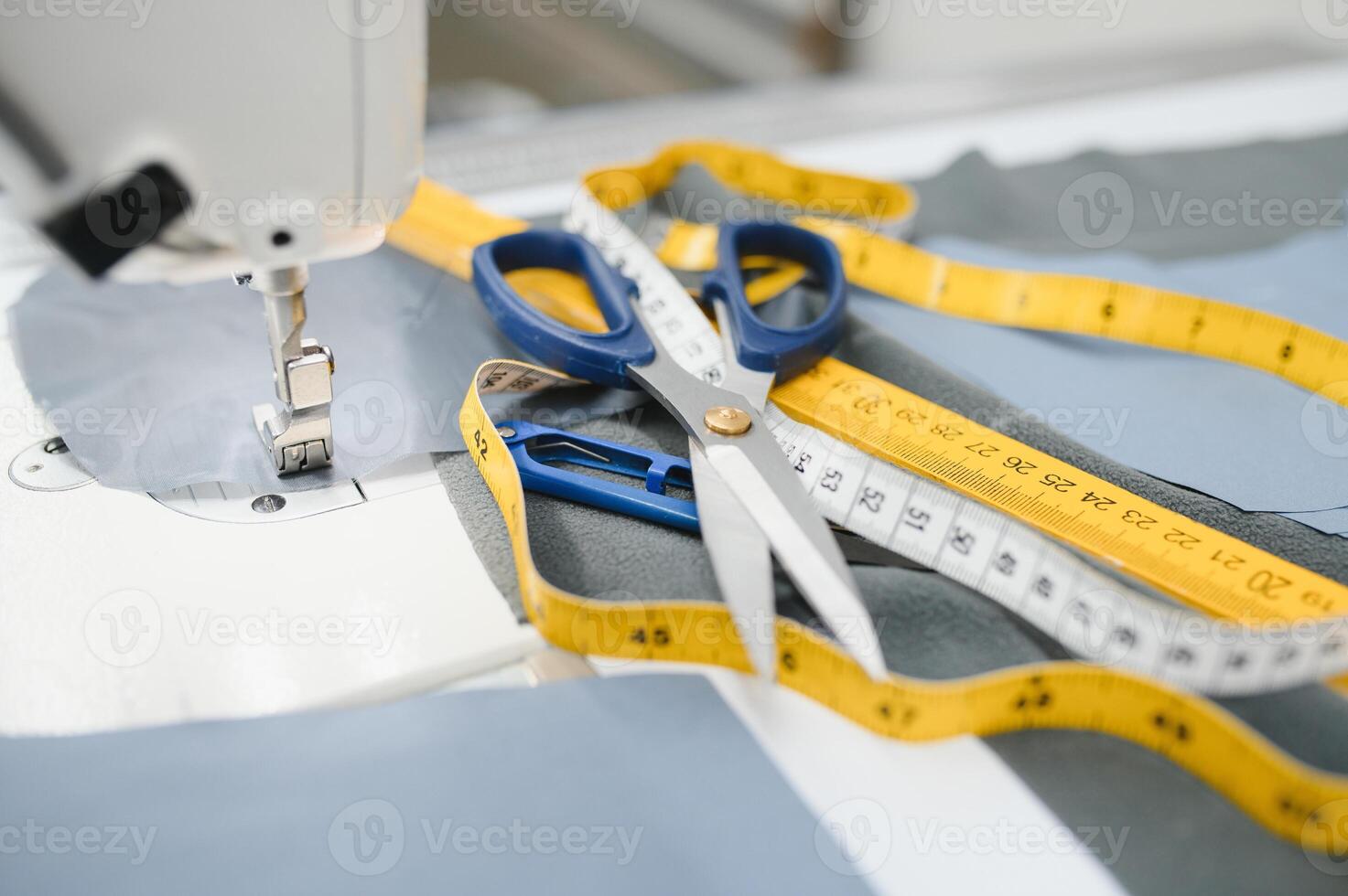 sewing supplies on the table next to the sewing machine photo