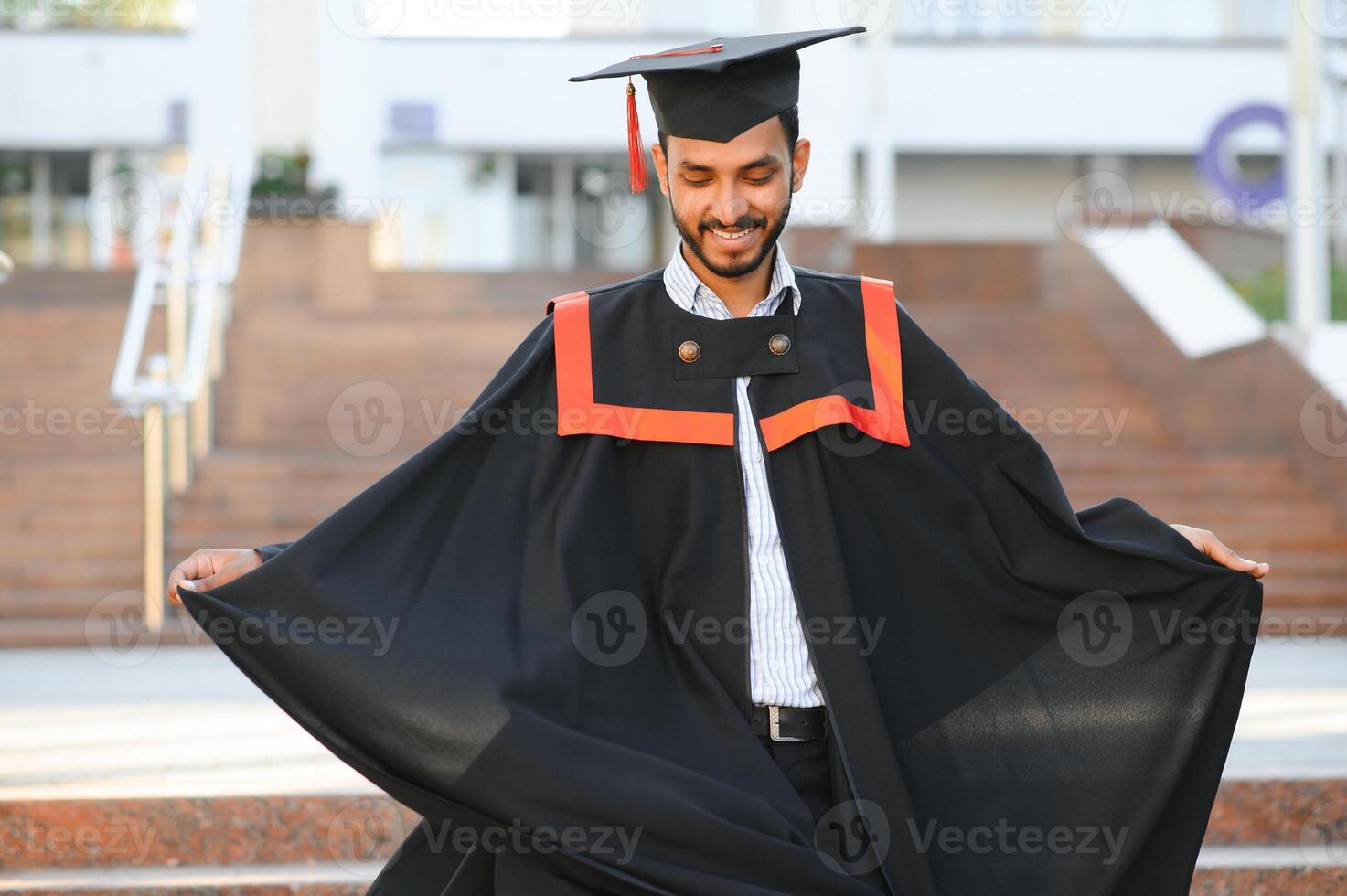 Indian university male student celebrating graduation photo