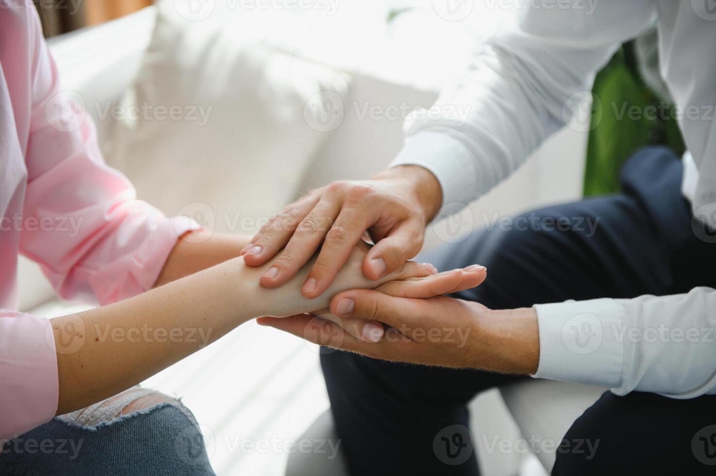 Close-up of the psychiatrist's hand holding the patient's hand. To encourage and comfort the patient. photo