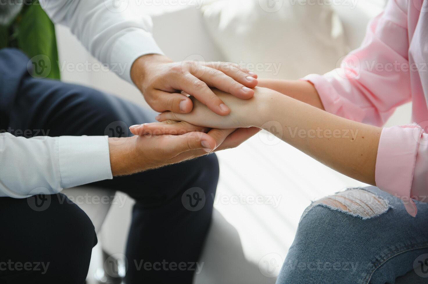 close-up of a female doctor's hands hugging the patient's hands. A gesture of support. Psychological assistance to a woman photo