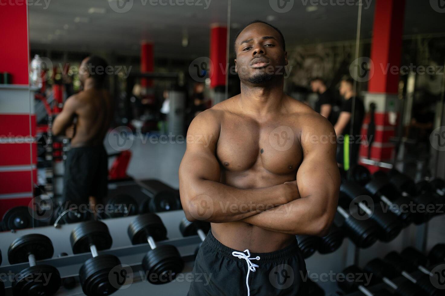 Young athletic African American man in the gym photo