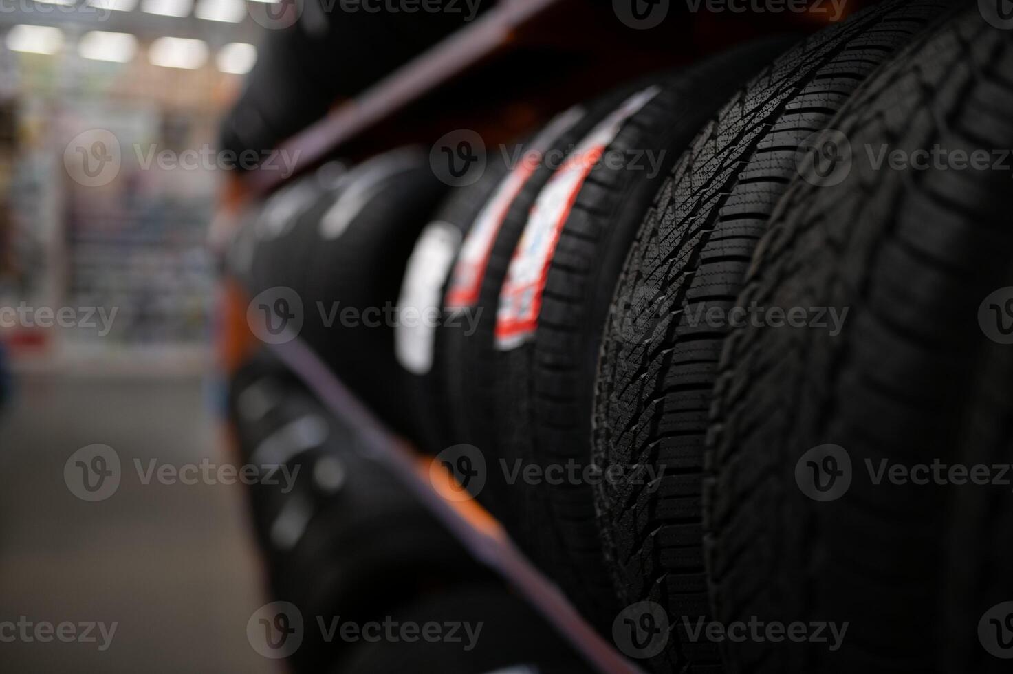 Car tires at warehouse in tire store photo