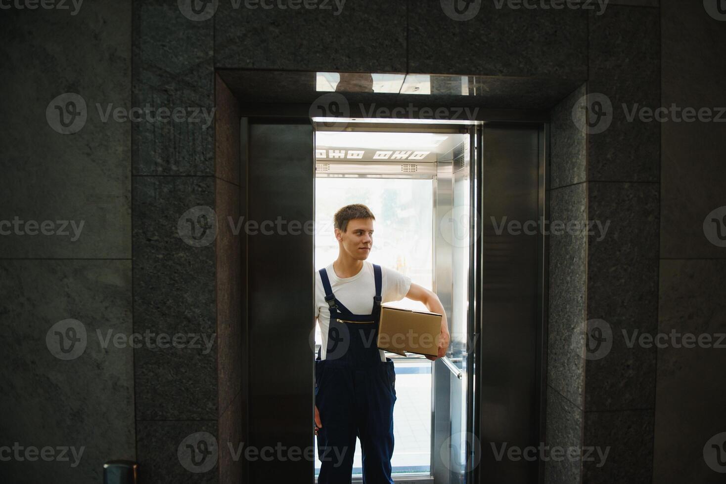 happy delivery man with box photo