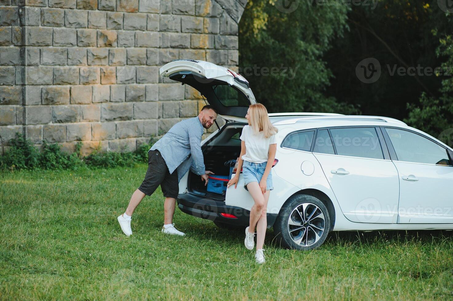 Portrait of happy family. Vacation, Travel - family ready for the travel for summer vacation. suitcases and car route. photo