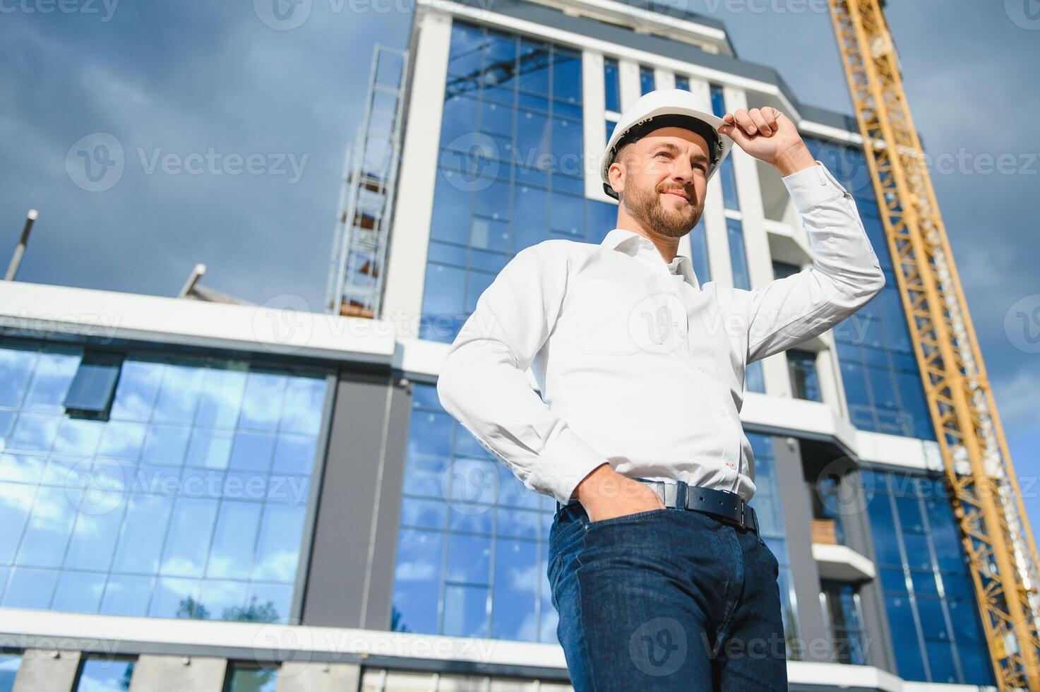 Architect in helmet near new building photo