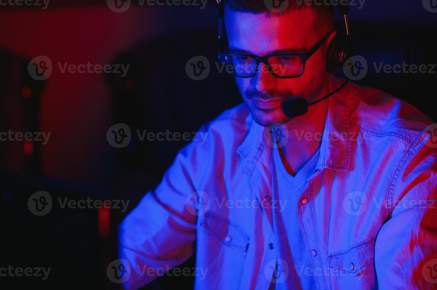 young man playing computer games on line photo